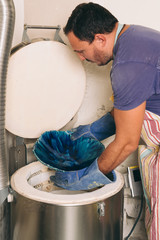 Man open pottery stove.