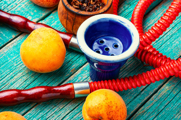 Smoking arab hookah with apricots