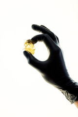 Sugaring hair removal, cosmetology, beauty, medetsin. Sugar paste in hands of beautician. 