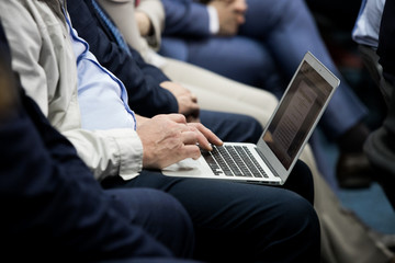 Sick man considering  life insurance with a notebook on his lap