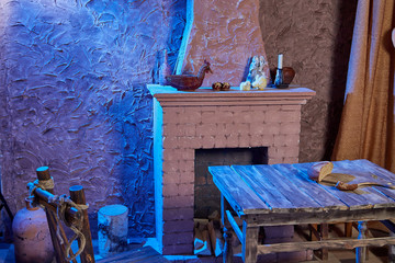 Room with wooden table with beautiful lighting. Stylized village corner for photography