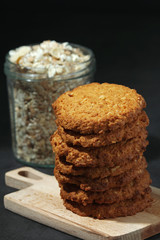 Homemade oatmeal cookie at dark background