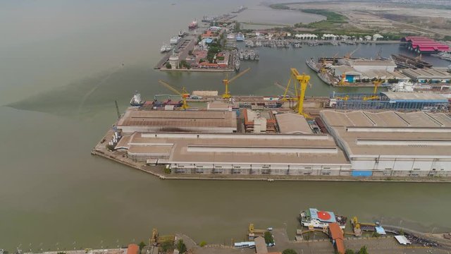 aerial view cargo and passenger seaport with ships and crane Tanjung Perak, surabaya, indonesia. docks for the repair and parking of ships, cargo port and container terminal. ship in industrial port