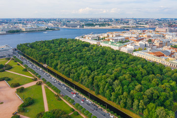 Summer garden, swan's groove and city of St. Petersburg aerial top view.