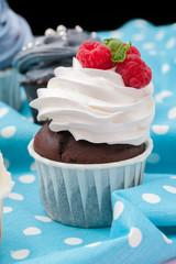 Cupcakes decorated with sprinkles and frosting - close up