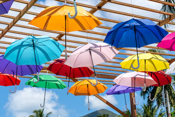 Fototapeta na wymiar Street decorated with colored umbrellas, island Koh Phangan, Thailand