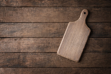 Wooden cutting board on background with copyspace