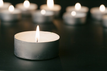 Candles Burning at Night. White Candles Burning in the Dark