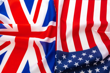 Flags of the USA and brithish Union Jack flag together waving