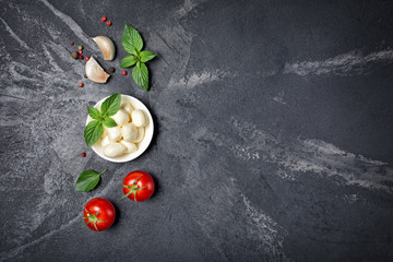 Small balls mozzarella cheese with Cherry tomatoes, garlic and basil