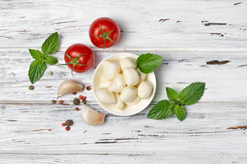 Small balls mozzarella cheese with Cherry tomatoes, garlic and basil