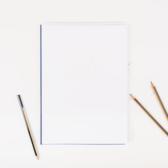 White paper with pencils