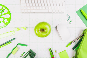 Fototapeta na wymiar Workplace with keyboard, apple and stationery