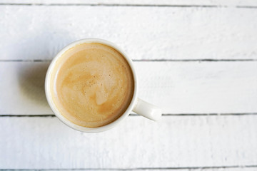 White cup of coffe , Copy Space on white wooden background