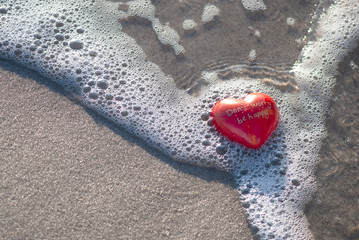 Fototapeta na wymiar Red Heart With Text On The Beach