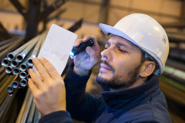 technician with torch checking metal tubes