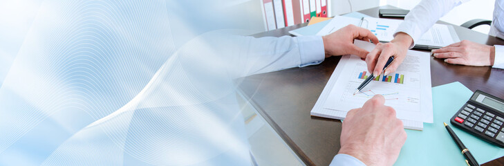 Business people analyzing a chart; panoramic banner