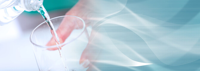 Pouring water into a glass; panoramic banner