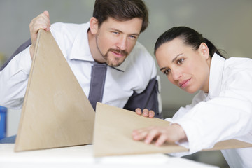 decorators are examining wooden templates