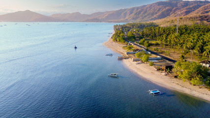 Padar island with aquamarine water and boats