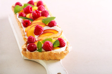 Peach and raspberry cream tart