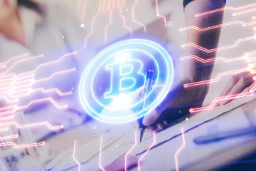 Cryptocurrency hologram over woman's hands writing background. Concept of blockchain. Multi exposure