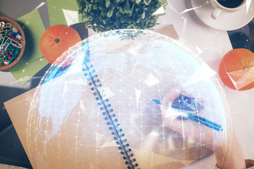 International business hologram over woman's hands taking notes background. Concept of success. Double exposure