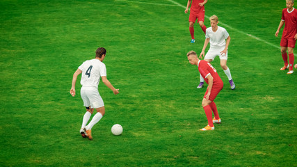 Professional Soccer Players Playing Pass Trying to Score a Goal. Impressive Professional Match on International Championship. 