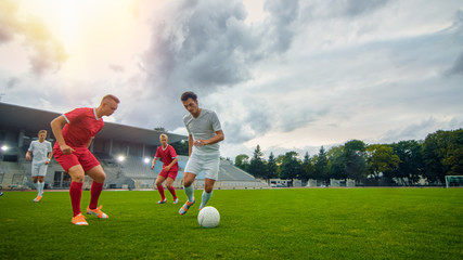 Professional Soccer Player Leads with a Ball, Masterfully Dribbling and Bypassing Sliding Tackles...