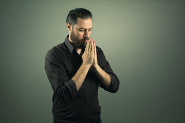 Beard man praying. Religious life