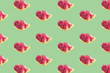 Fruit pattern of Pomegranates on green background.