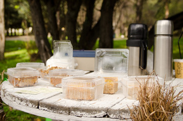 wooden table in a rustic style with pastries in boxes in a rustic-style cafe