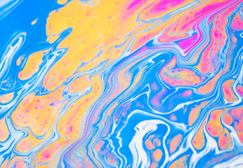 Abstract colorful painting background made in fluid art technique. Trendy colors pattern.