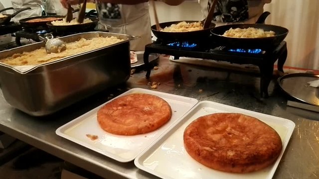 traditional friuli food. Preparation of frico in a festival