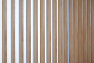 wooden vertical lath in warm pastel color, japanese style.