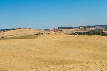 Fototapeta na wymiar wonderful panorama of Tuscan countryside with blue sky Italy