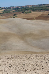Countryside landscape in Tuscany: cultivated fields in the hills
