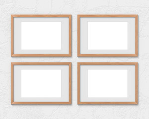 Fototapeta premium Set of 4 horizontal wooden frames mockup with a border hanging on the wall. Empty base for picture or text. 3D rendering.
