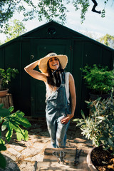 Portrait of a woman on the farm with a hat