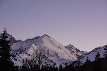 german alps mountain top in winter dusk