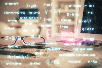 Formulas drawing with glasses on the table background. Concept of science. Double exposure.