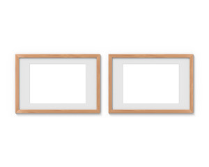 Set of 2 horizontal wooden frames mockup with a border hanging on the wall. Empty base for picture or text. 3D rendering.