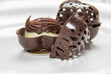 Chocolate candy stuffed with truffled cream of milk and chocolate. Served in chocolate heart basket.