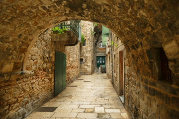 Fototapeta na wymiar Historic street with tunnel made with stone, Split fortress, Croatia
