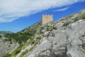 Historic fortress on the hill above Omis and Cetina River, Croatia