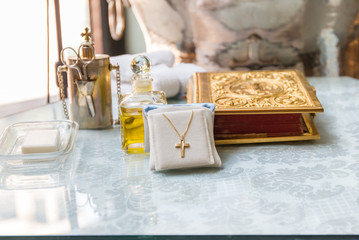 Fototapeta na wymiar Accessories of a priest with Oil bottle for Christian baptism