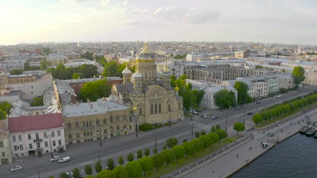 Aerial view of the Assumption Church and the embankment of the Neva River in Petersburg in the evening at sunset