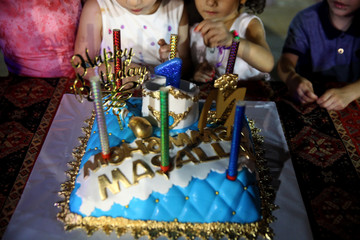 Fototapeta premium Baby's first birthday cake with marzipan