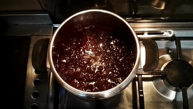 bolling jam. Cooking marmelade of prunes (it looks like a magic potion)