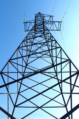 Electricity pole with a blue sky on background. Electricity pylon.
